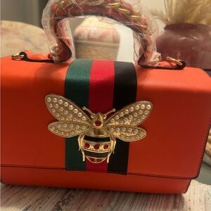 Orange Designer Handbag with Gold Bee Accent